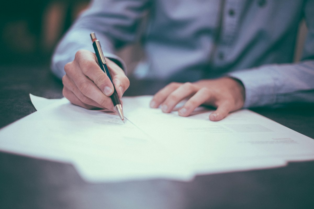 Permission letter samples displayed with professional paperwork on a desk
